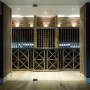 Wandsworth Edwardian basement swimming pool and gym | Basement wine storage | Interior Designers